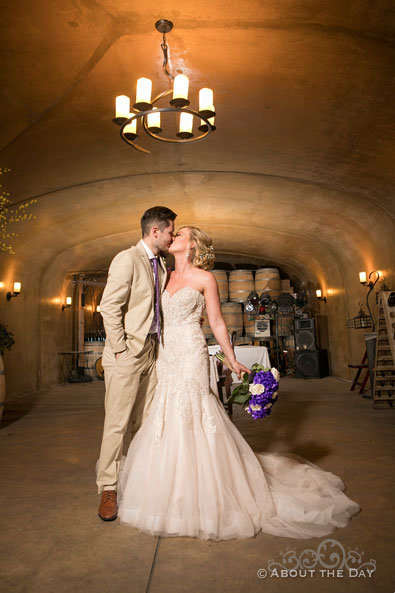 Bride and Groom kiss in the cave at Karma Vineyards