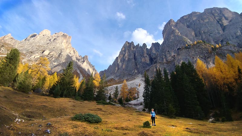 Looking up at the towering peaks of Plattkofel and Langkofel looming over Sonia