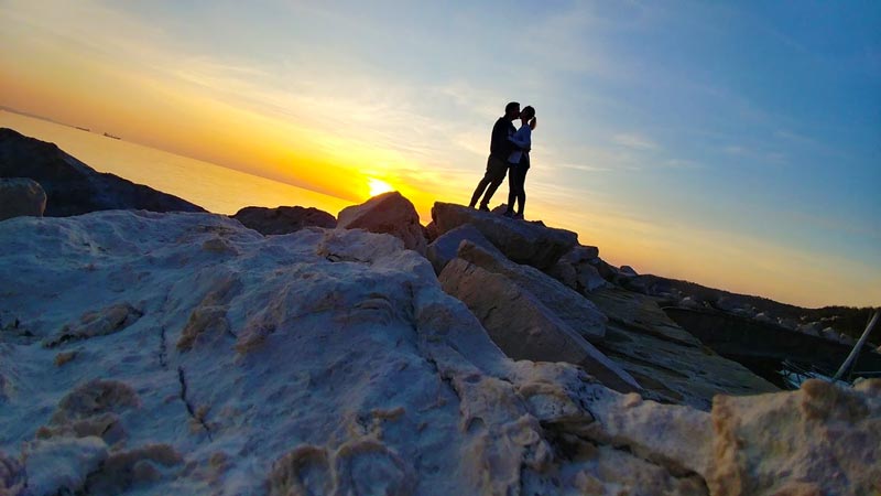 Stephen and Sonia pose like awesome people at sunset Trieste