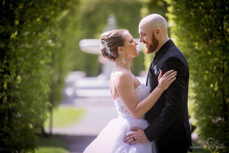 David & Elisha stand under the green arches in Cannon Park