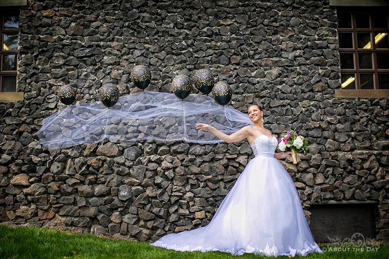 Bride's veil is carried by balloons