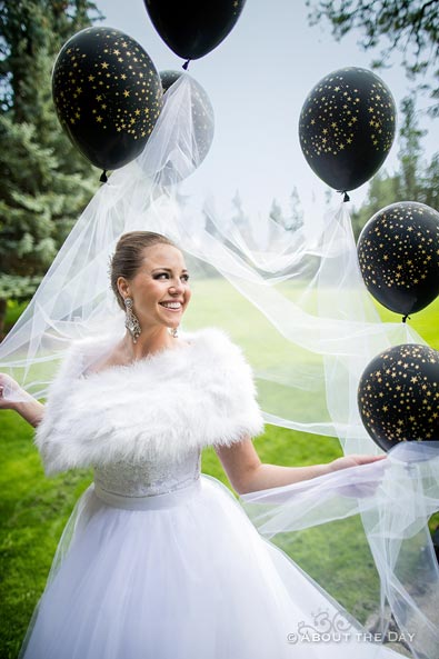 Elisha's veil is lifted around her by balloons