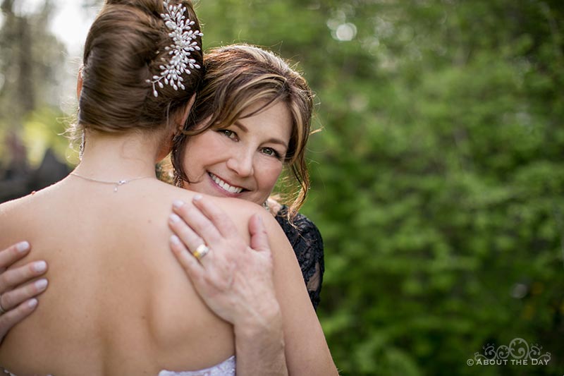 Mother of the Bride looks over her daughters shoulder