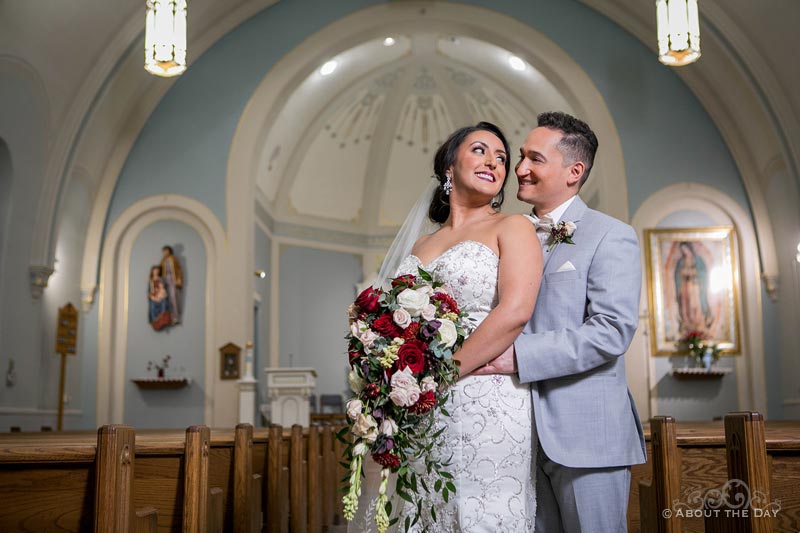 Erik and Faviola look into each others eyes in St. Joseph's in Elgin, IL