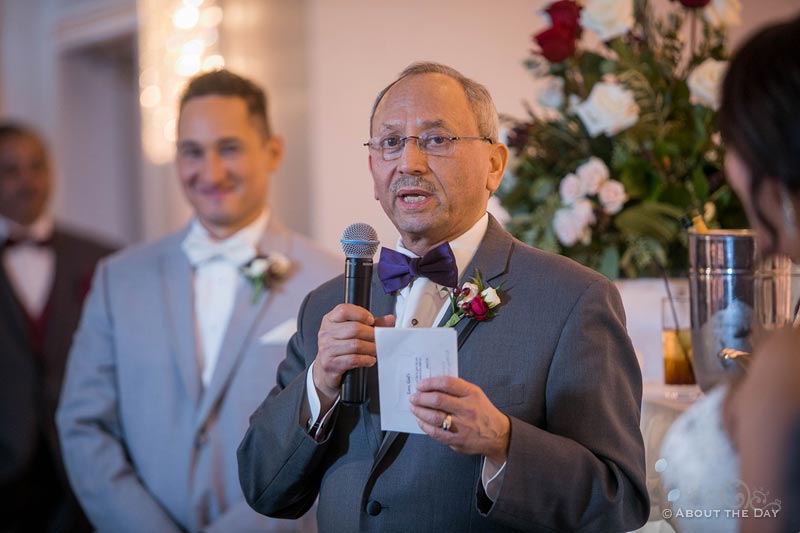 The groom's father gives a long toast