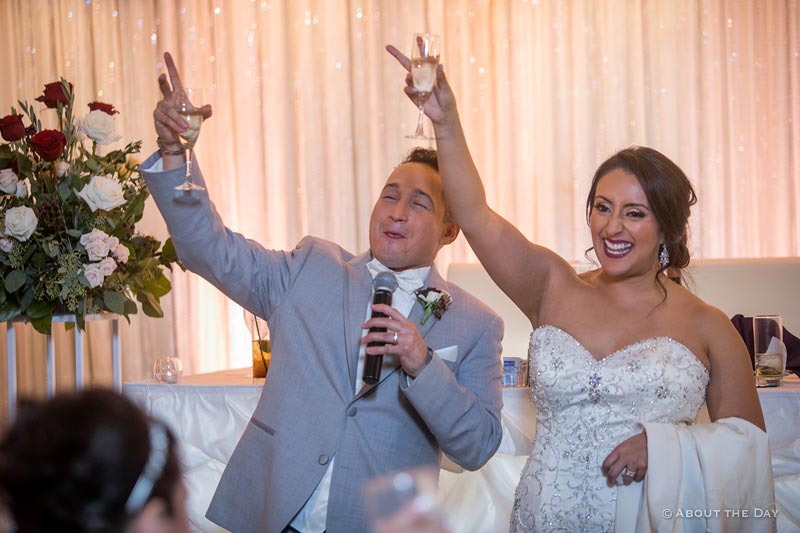Erik and Faviola celebrate their wedding with a toast