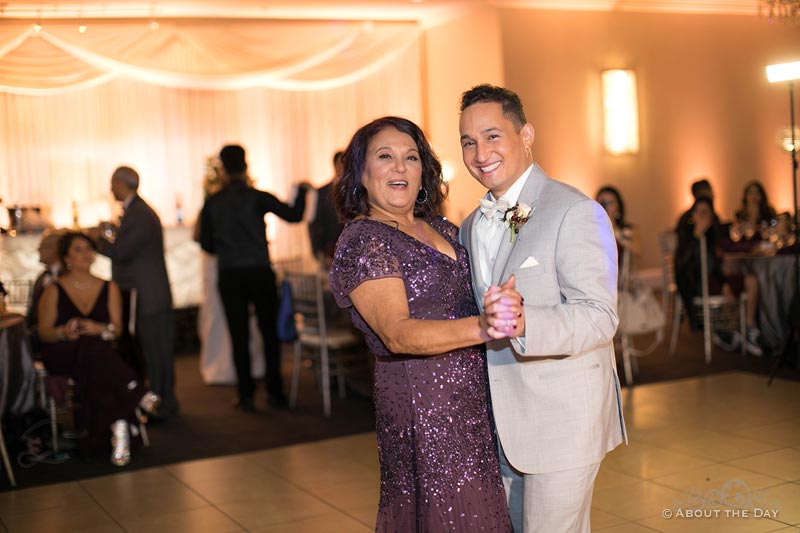 Erik and his mother dance together