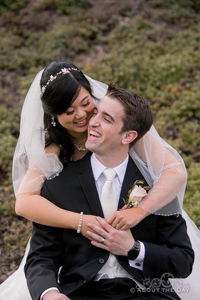 Garrett & Eugenia laugh and snuggle together at Zenith Vineyards