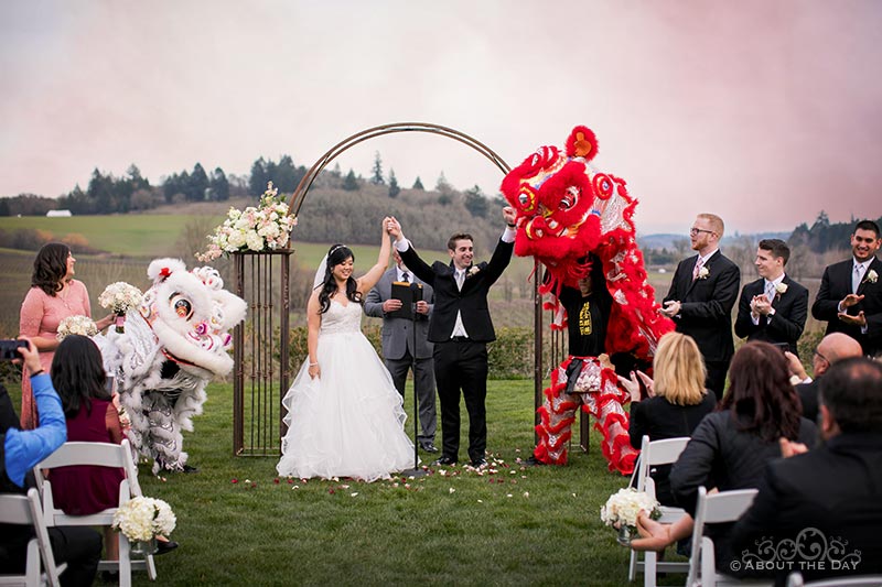 Bride and Groom with Chinese lions at Zenith Vineyards