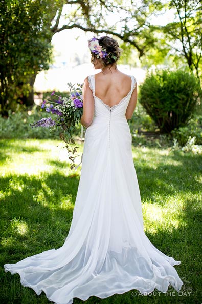 Raquel's wedding dress from behind at Wisteria Gardens