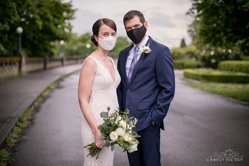 Bride & Groom in Covid-19 masks on the street outside Parsons Gardens in Seattle