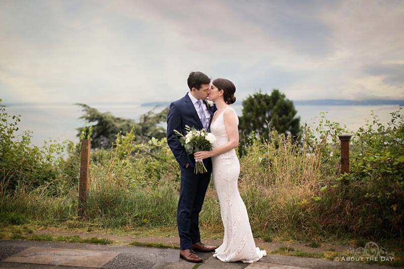 David & Vanessa kiss overlooking the sound outside Parsons Gardens in Seattle