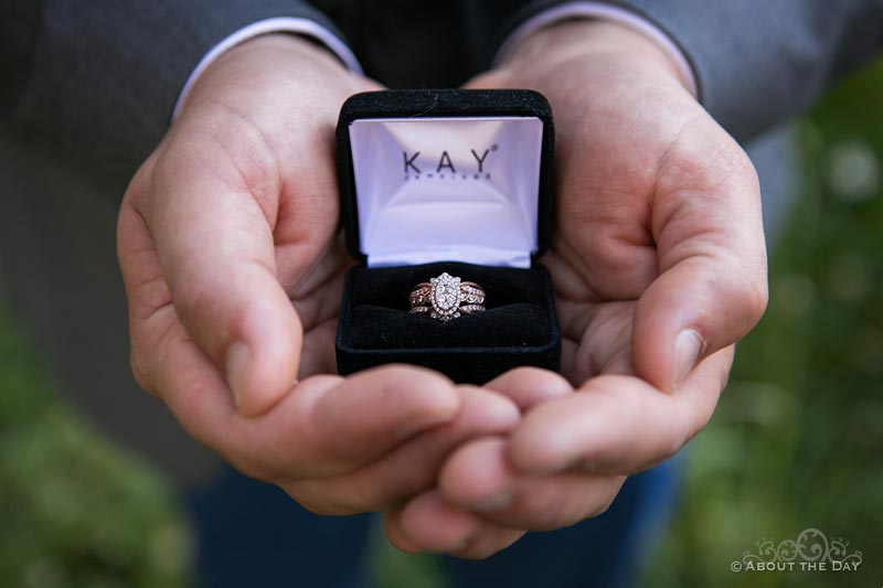 James holds Courtney's wedding ring from Kay Jewelers