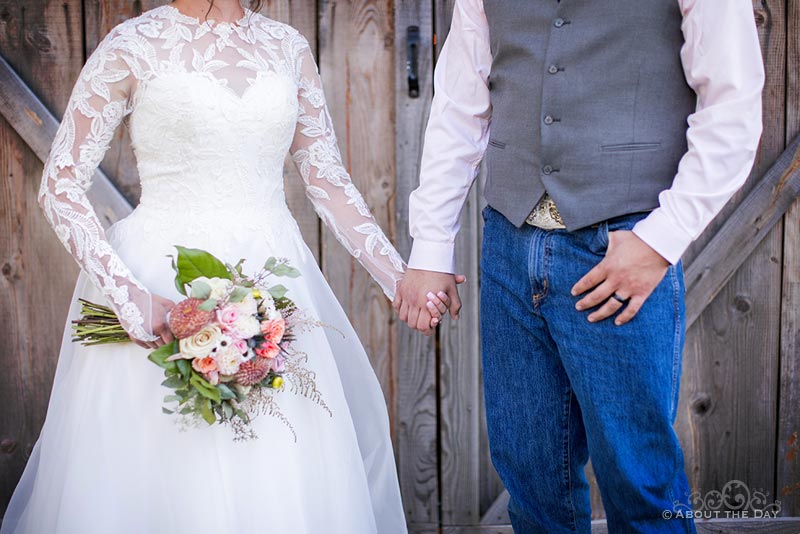 Bride & Groom hold hands at The Barn At Blue Meadows