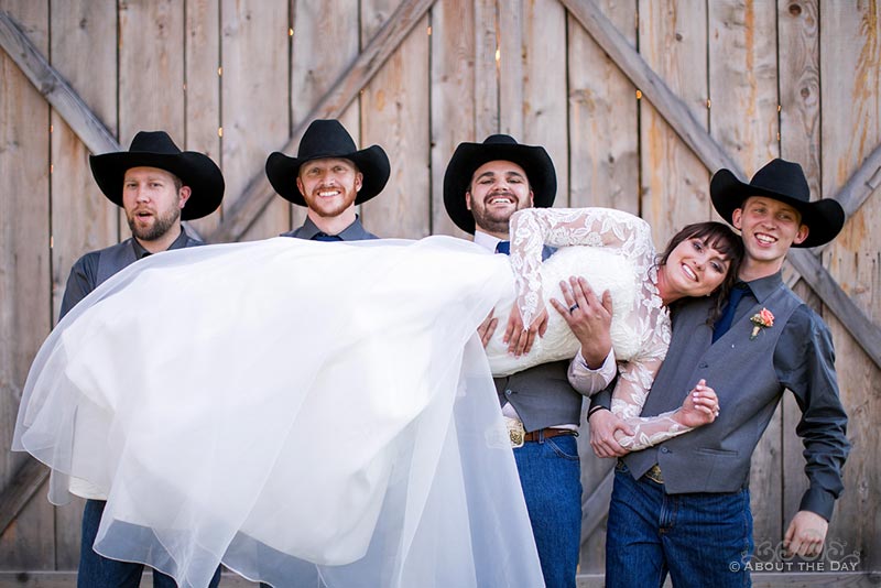 Courtney is held up by the Groom and his groomsmen