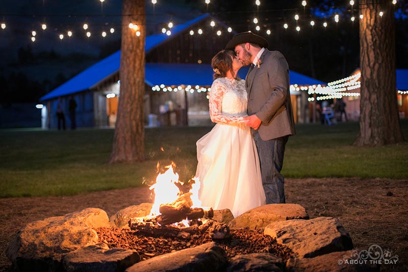 James & Courtney snuggle fireside at The Barn At Blue Meadows